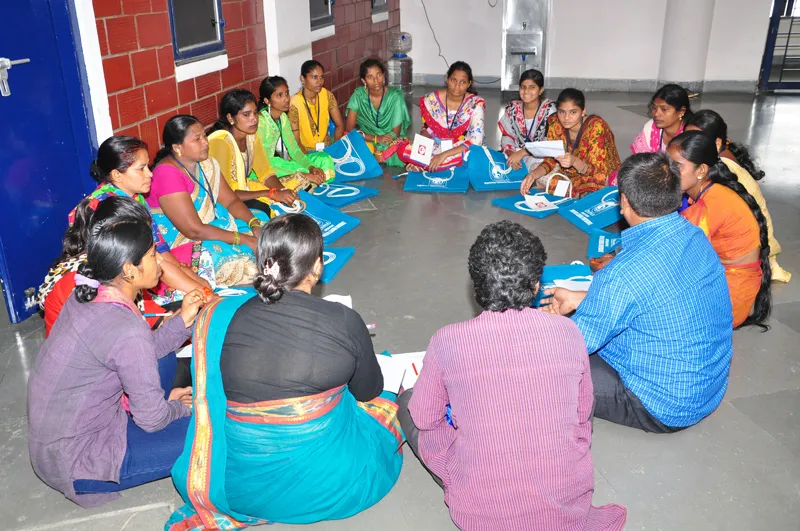 women learning jute bag making