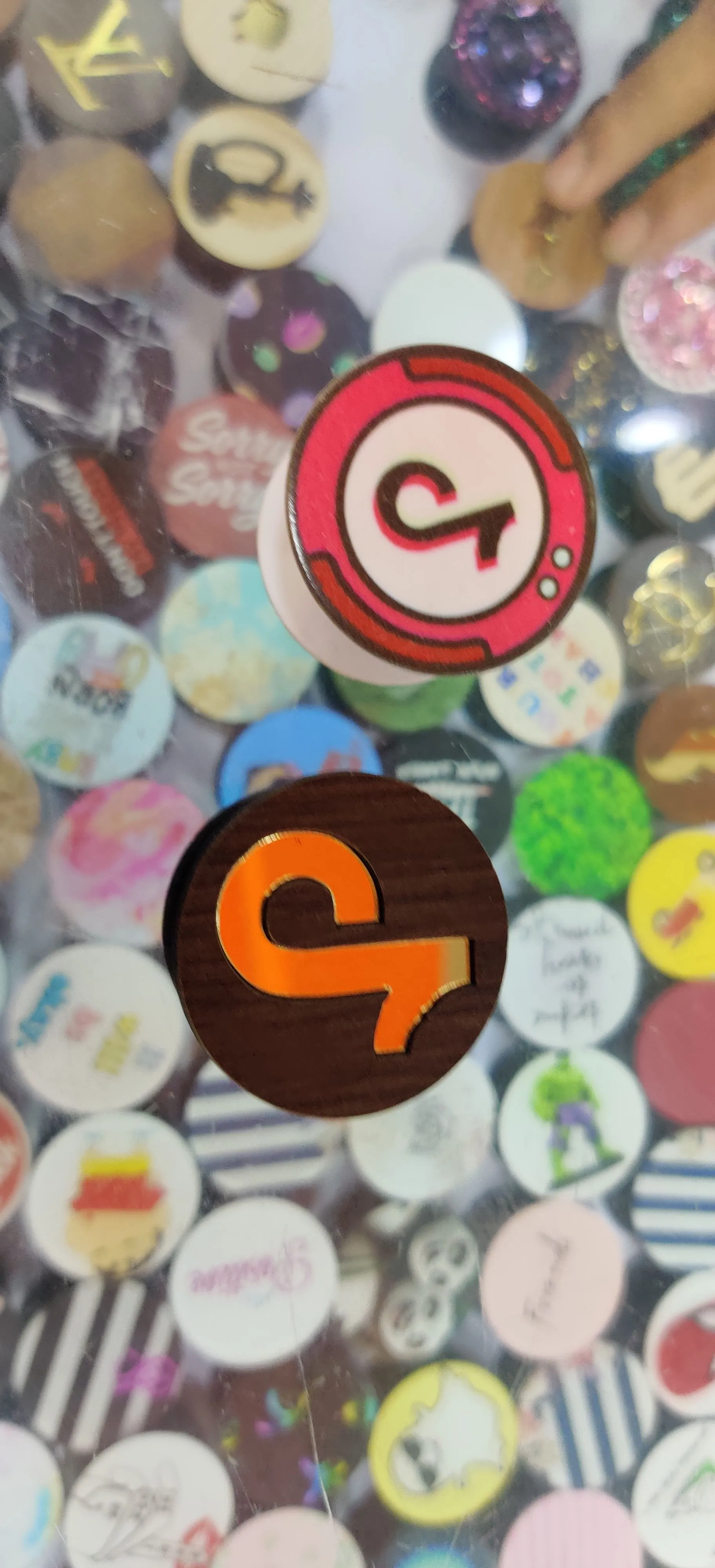 Pop sockets with TikTok's logo  