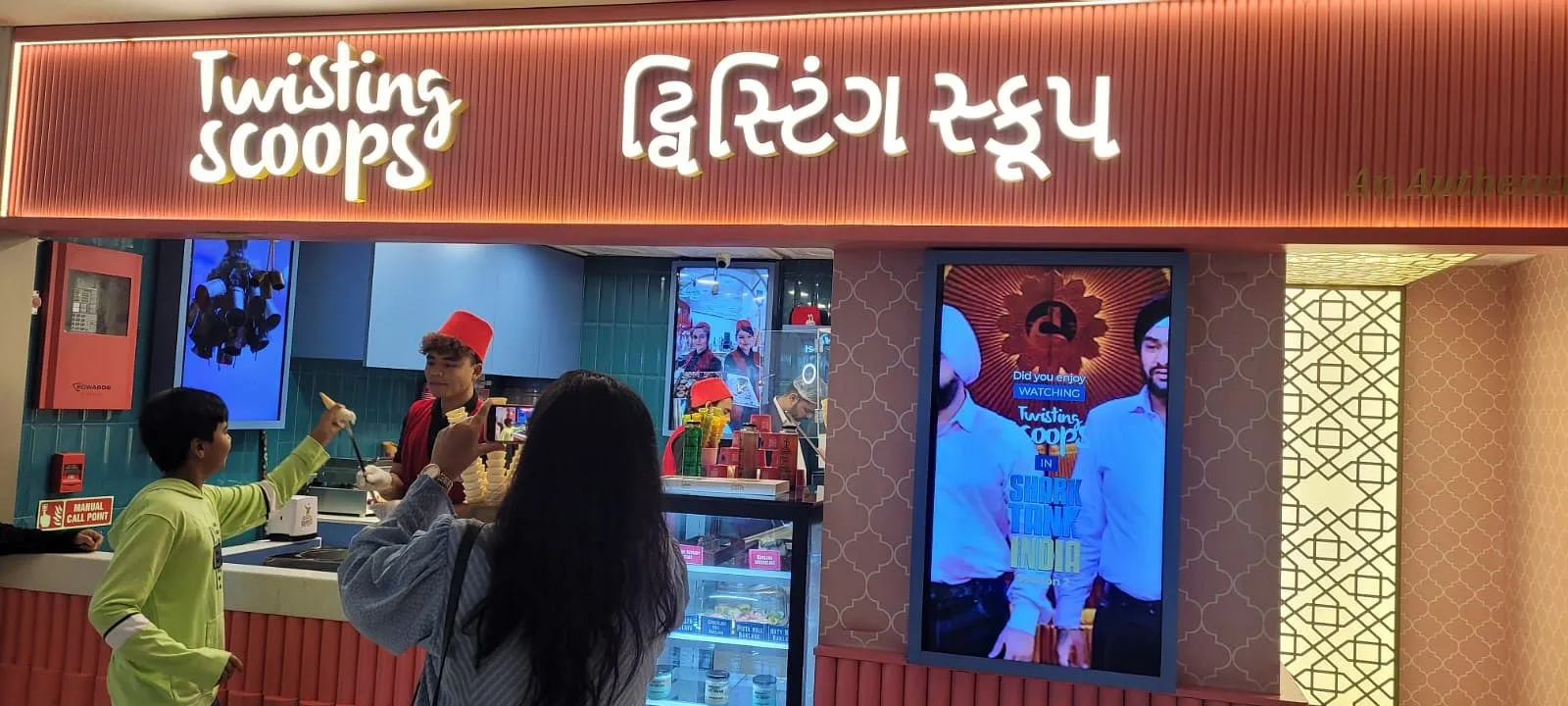 Twisting Scoop's Ahmedabad store with a display board showing its Shark Tank appearance  