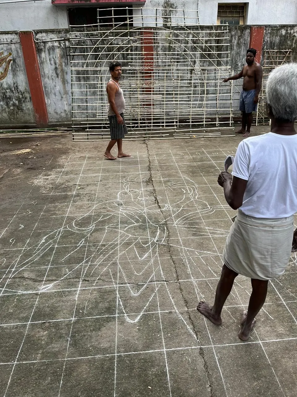 Thangam's chalk-drawn sketch on the temple floor.   