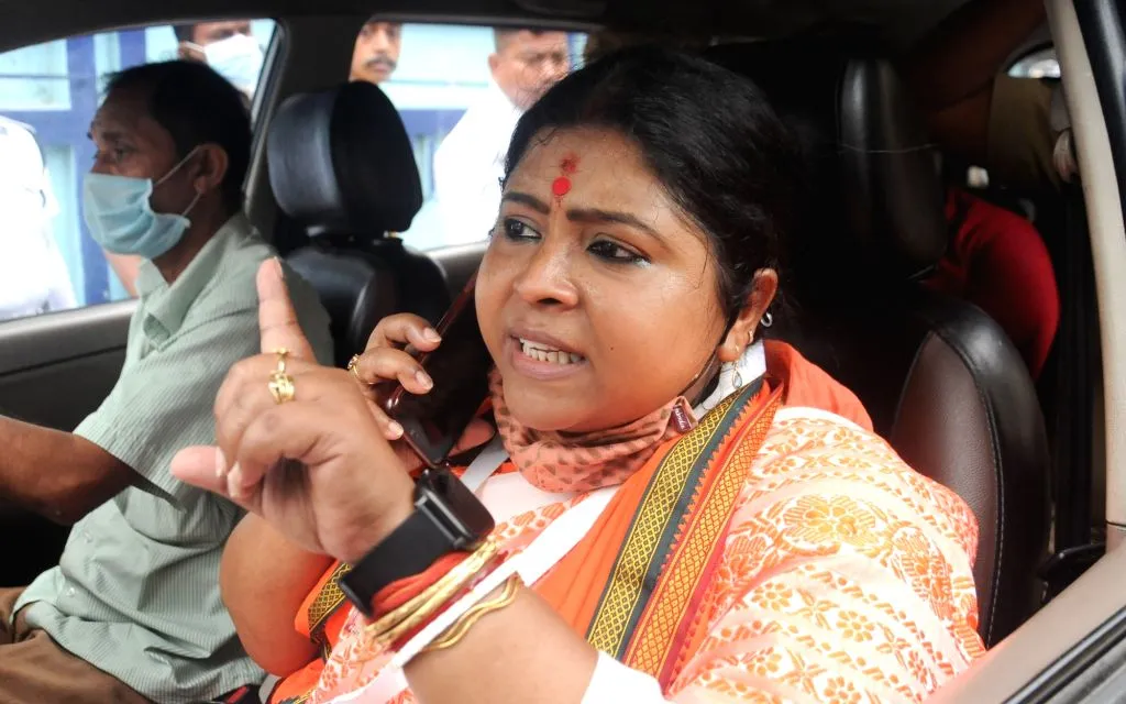 BJP candidate Keya Ghosh arrives to visit a polling booth