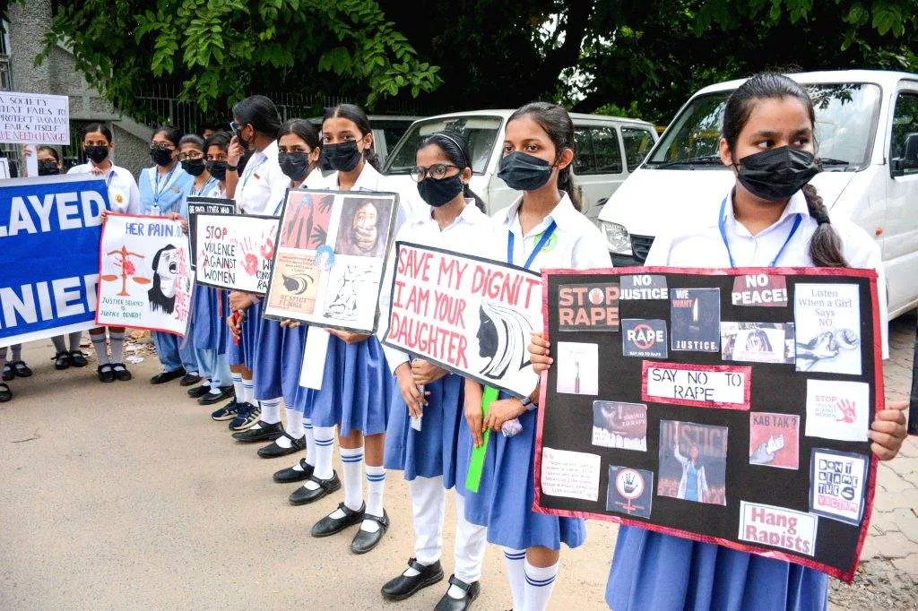 Students of Carmel High School hold placards and stage a demonstration  against the rape and murder ...