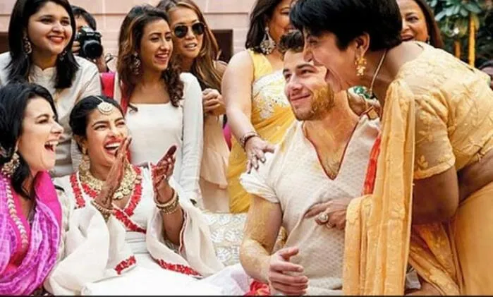 নিকৰ সৈতে এক পৰম্পৰাত প্ৰিয়ংকা  