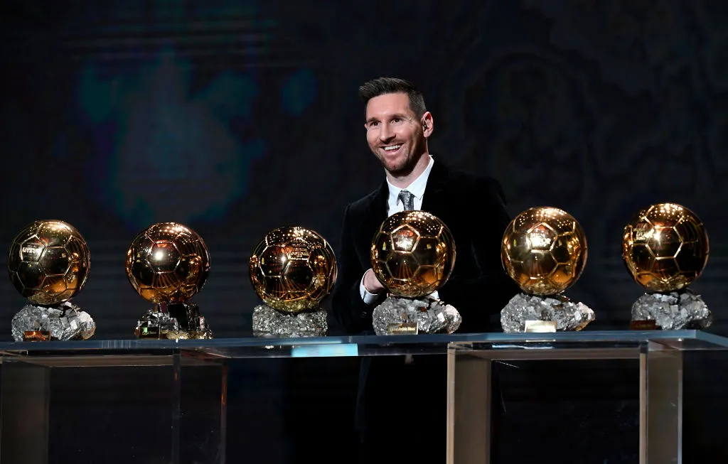 Lionel Messi poses with his six Ballon D'Or 