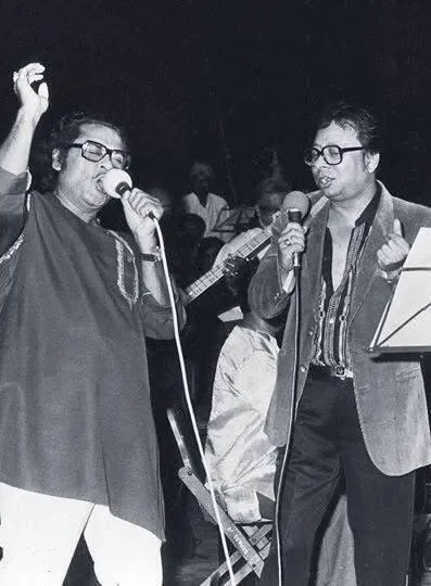 Kishore Kumar performing live on stage with composer singer R D Burman