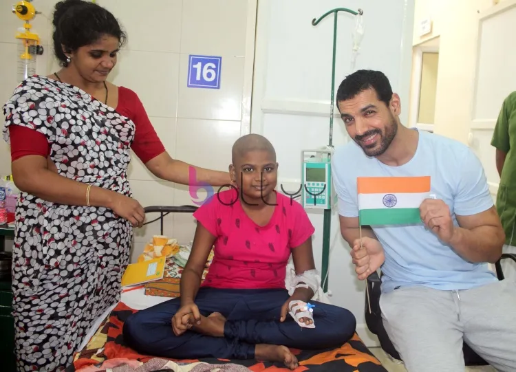 John Abraham with patient at Bai Jerbai Wadia hospital for Children