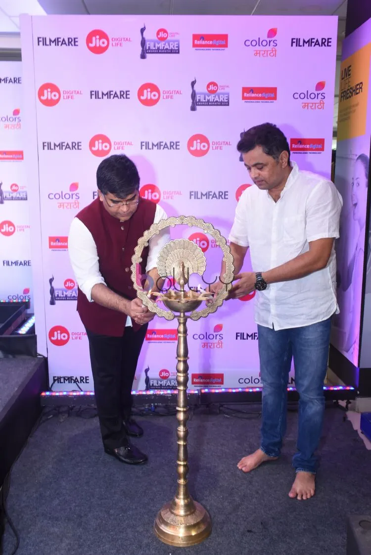 Jitesh Pillai and Subodh Bhave lighting the lamp