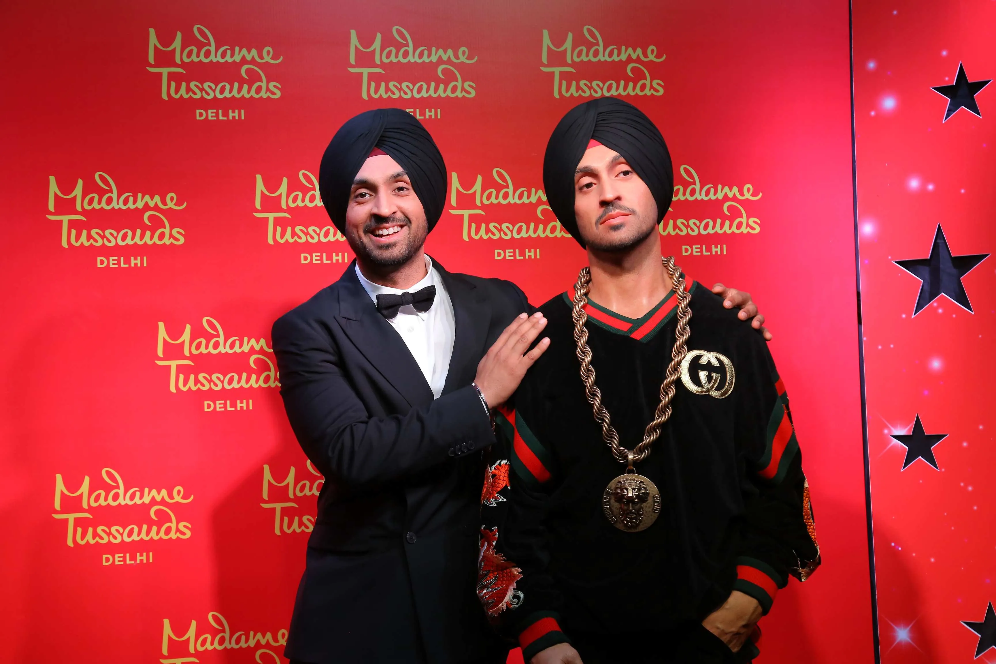 Diljit Dosanjh with his figure 