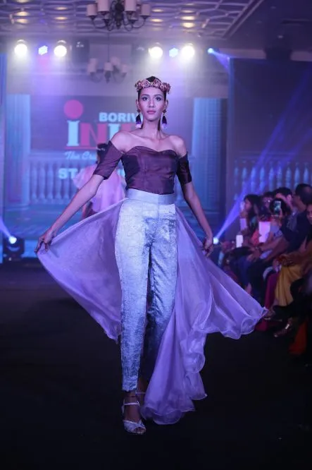 Model Walks The Ramp At Layer'M 2019