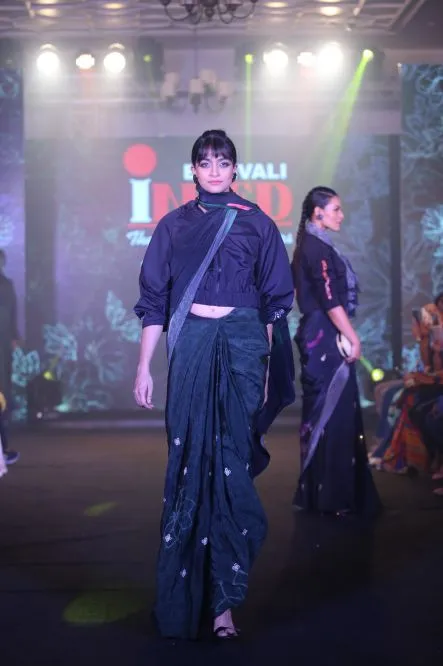 Model Walks The Ramp At Layer'M 2019