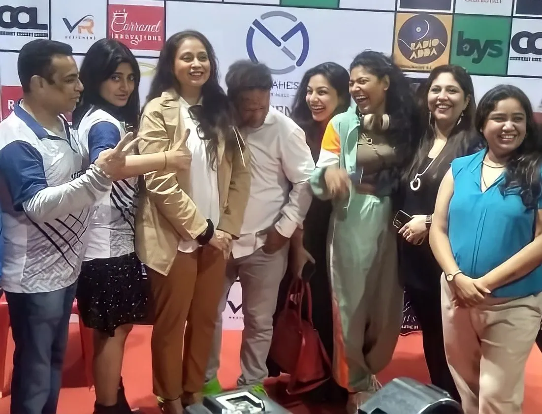 Celebrities sharing a light moment between the matches
