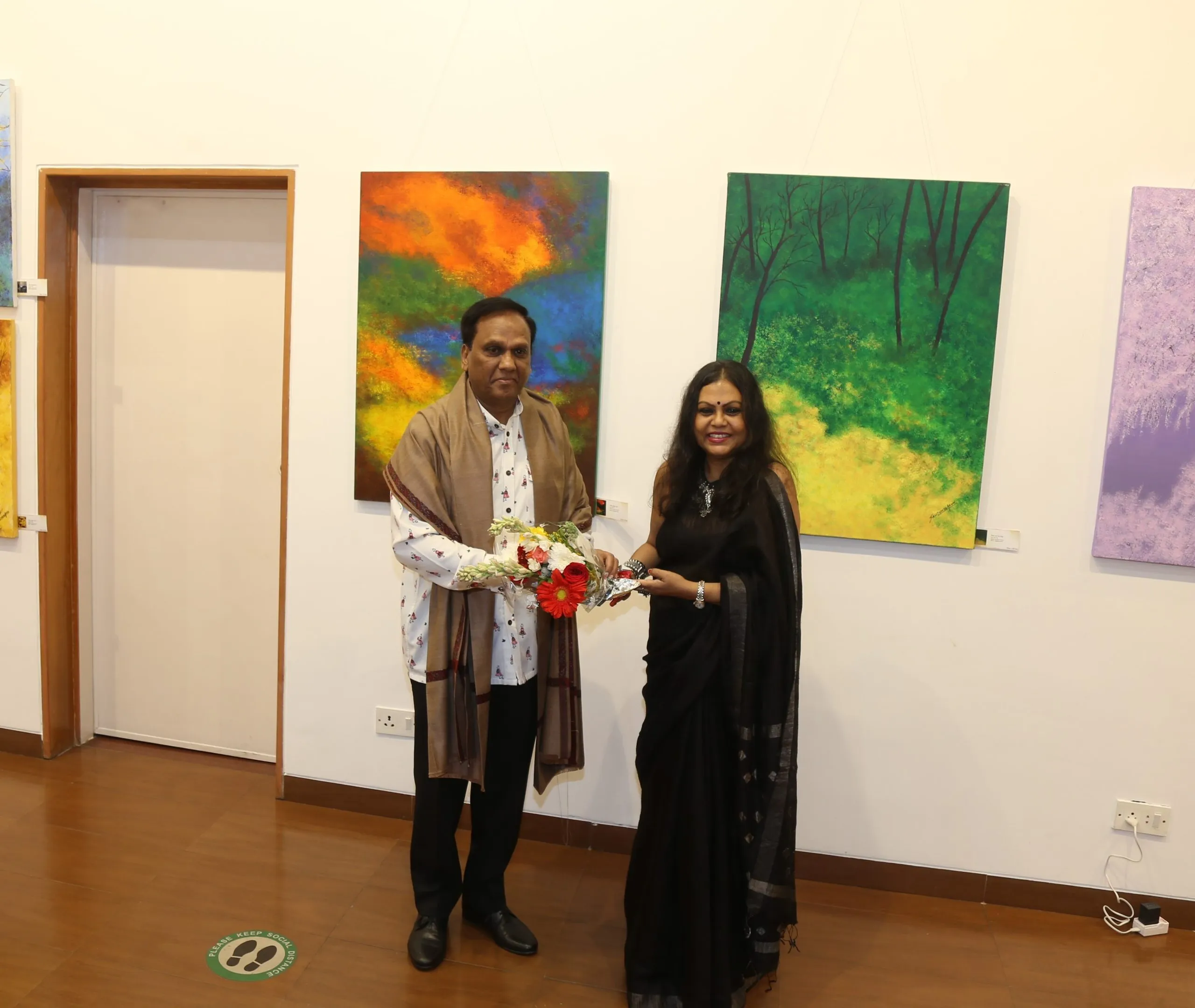 Ambassador Valsan Vethody and Sanjukta Arun at Sanjukta Arun's Painted Ballads exhibition at Nehru Centre Art Gallery