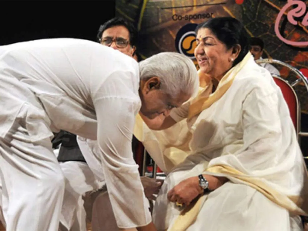 Pyarelal-jee touching the feet of Lata-Didi Mangeshkar