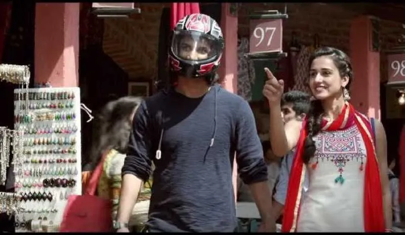 DHONI HIDES UNDER A HELMET