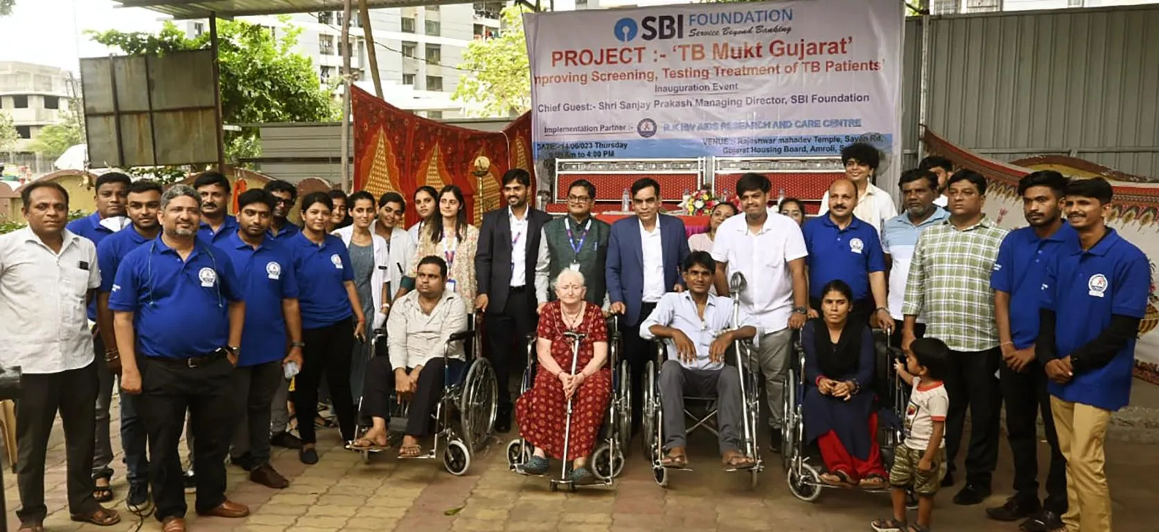 Sanjay Prakash & Dr. Dharmendra Kumar distributing wheel chairs