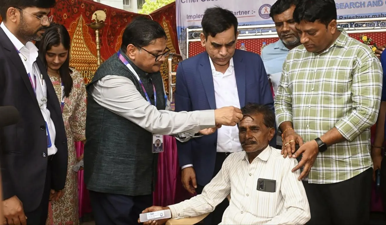 Sanjay Prakash & Dr. Dharmendra Kumar with patient
