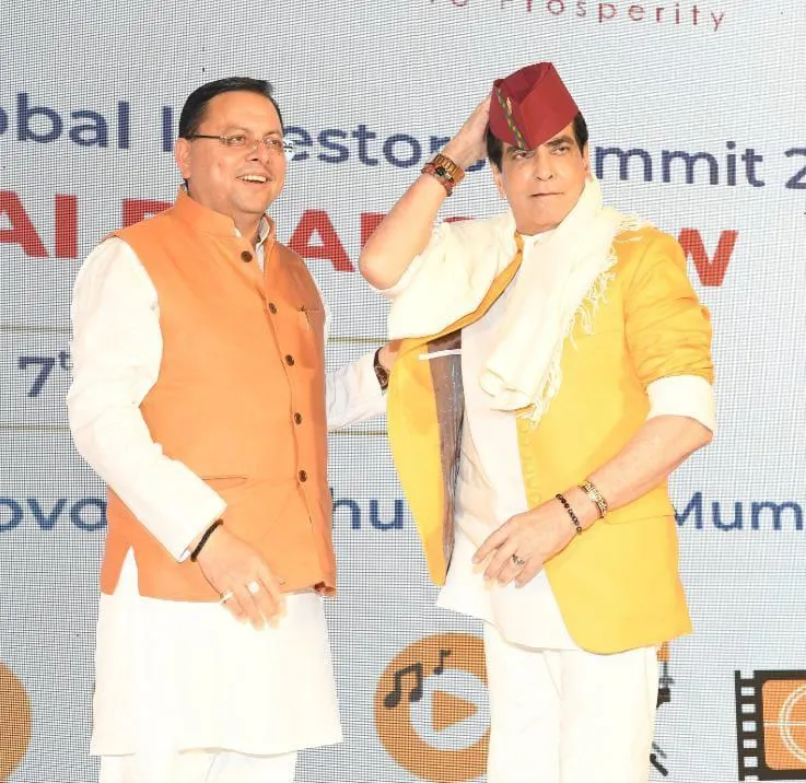 Uttarakhand CM P S Dhami with Jeetendra wearing pahadi topi