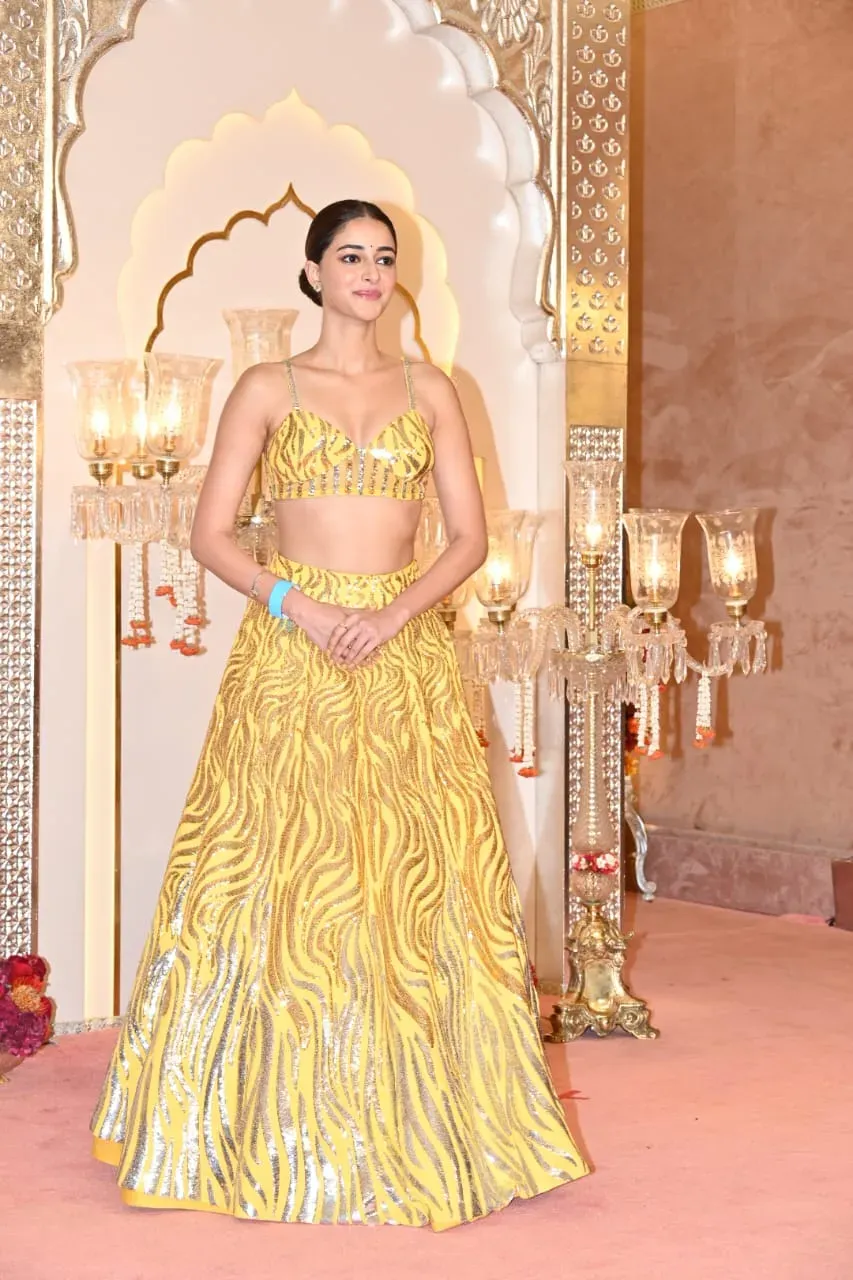 Ananya opted for an exquisite yellow lehenga that was adorned with shimmering golden embroidery, beautifully covering the entire outfit. The lehenga was paired with a perfectly matching blouse.