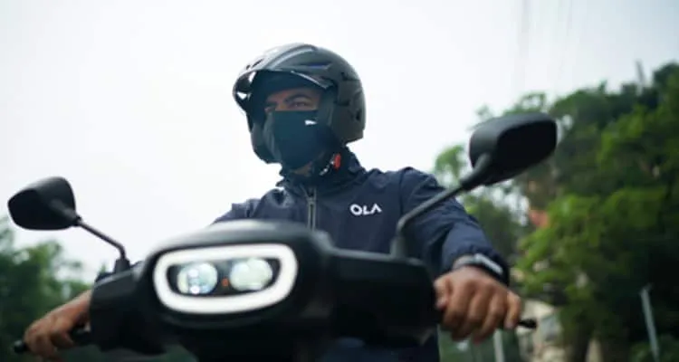 Bhavish Aggarwal riding Ola Scooter