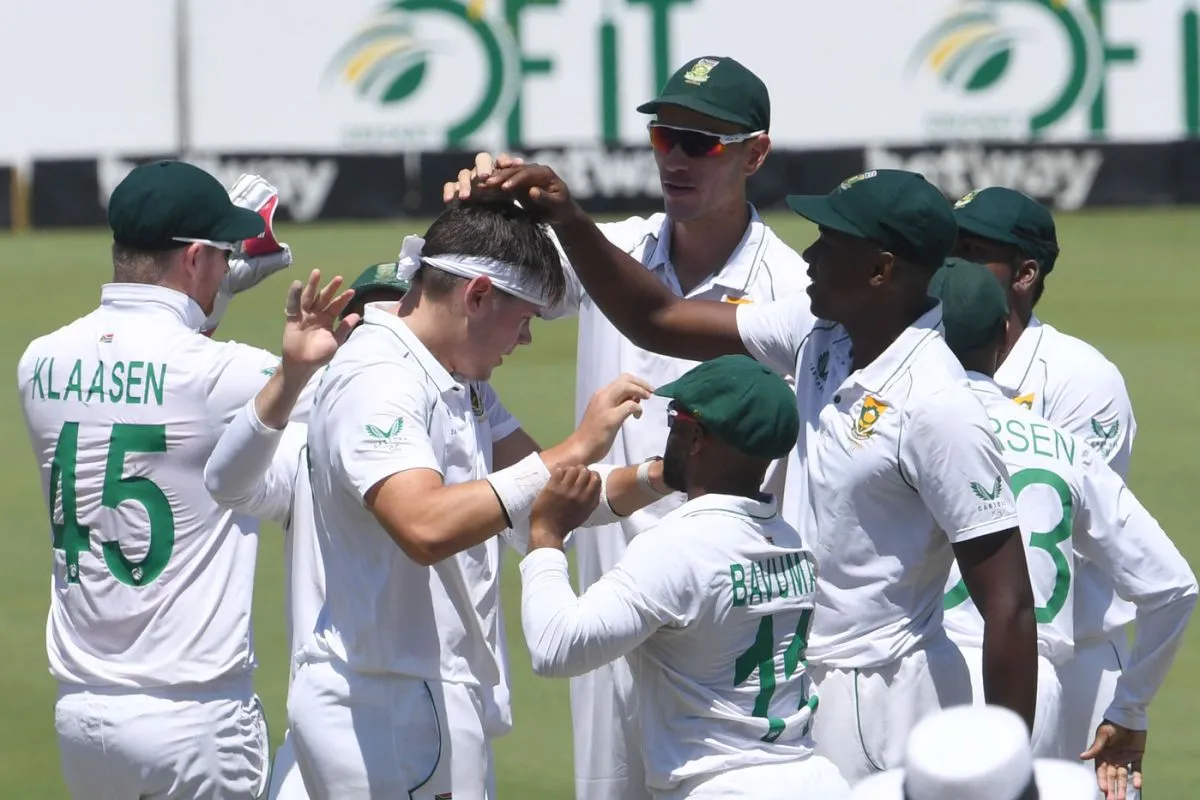 Gerald Coetzee gets a pat on the head from team-mates after removing Tagenarine Chanderpaul, South Africa vs West Indies, 1st Test, Centurion, 2nd day, March 1, 2023 