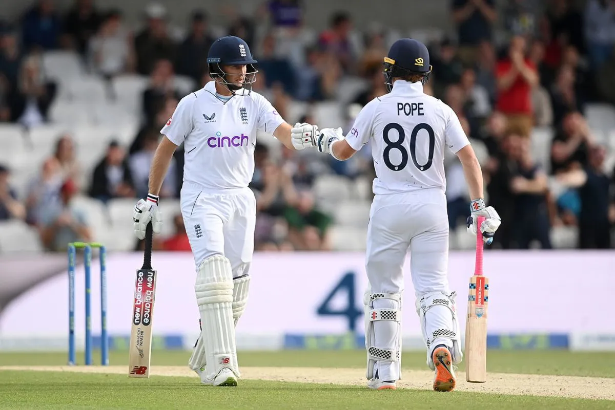 Joe Root punches gloves with Ollie Pope on the way to a century stand, England vs New Zealand, 3rd Test, Headingley, 4th day, June 26, 2022