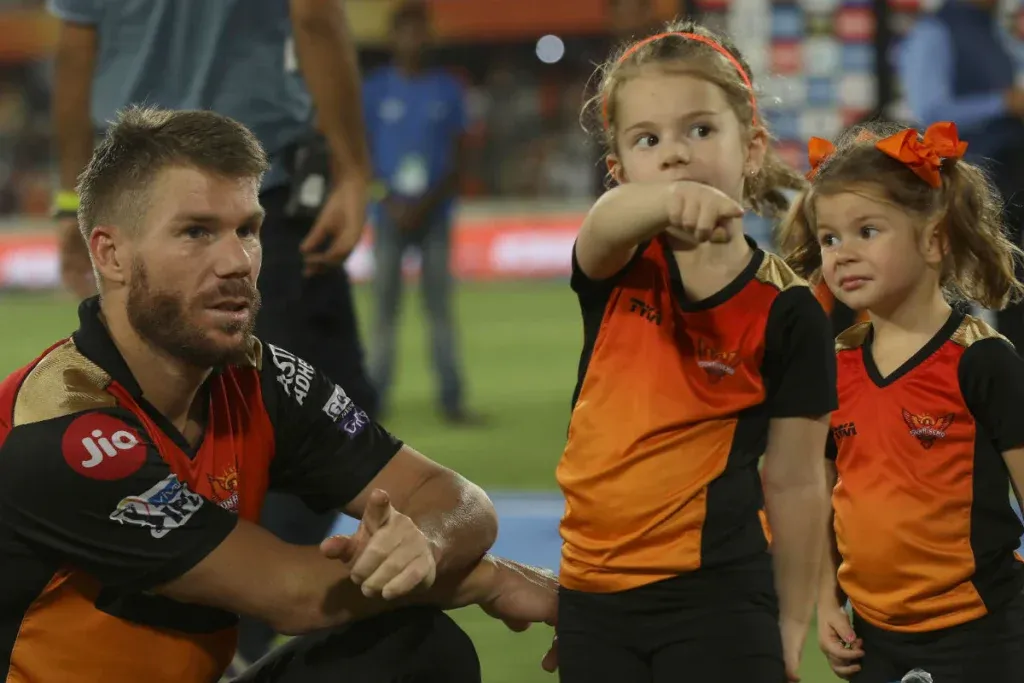 David Warner with her daughters