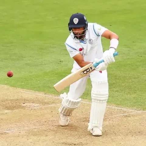 Leus du Plooy plays a ramp shot with a reverse bat