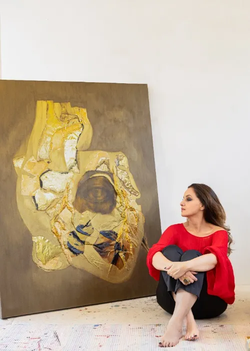 Artist Laila Khan Funiturewalla with her artwork 'Hello From The Other Side'