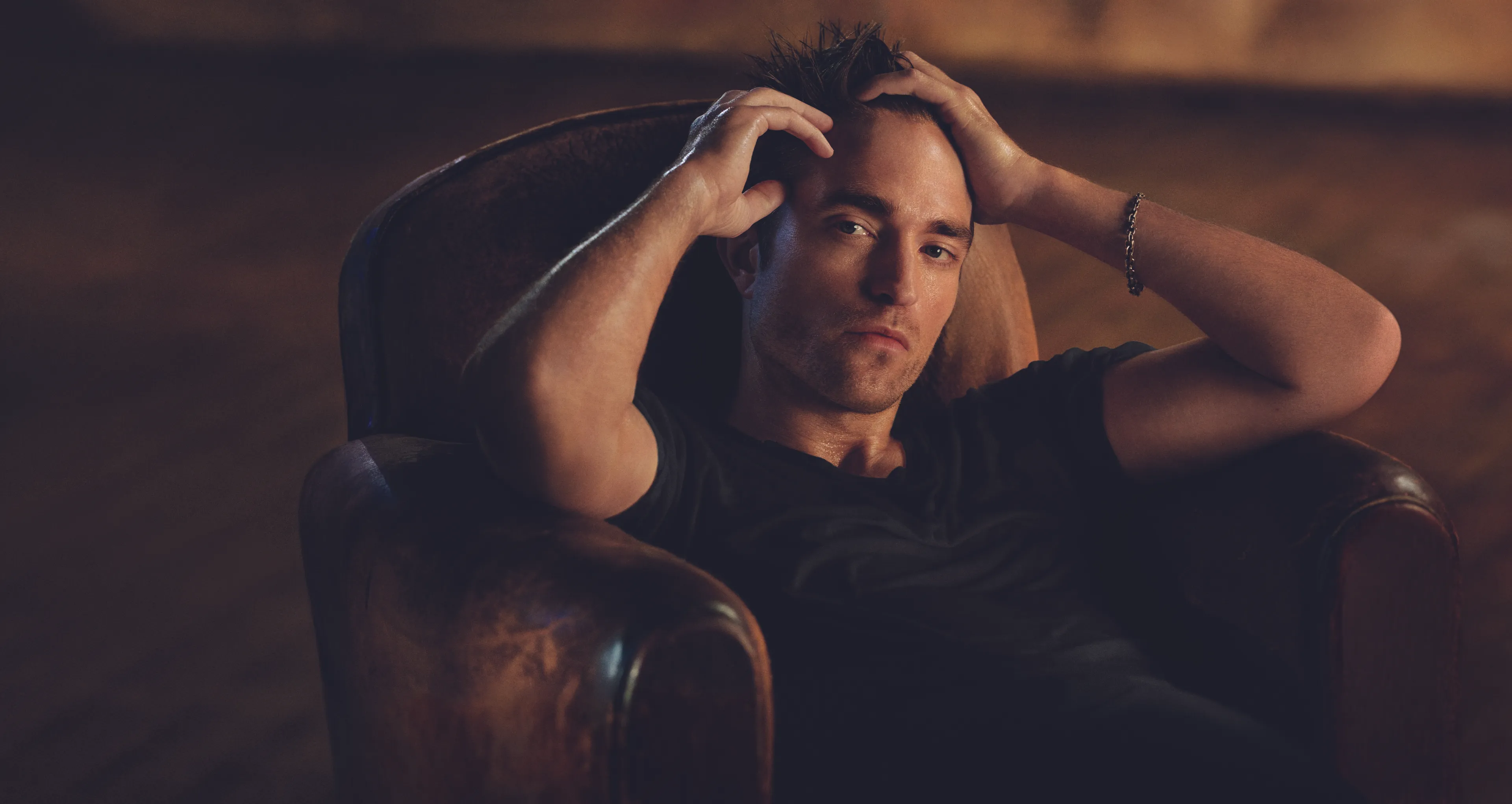 a seated individual exhibiting signs of distress or contemplation