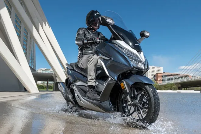 india's first premium mid size scooter, HMSI starts delivery of premium Forza 300 scooter in india, honda motorcycle and scooter india