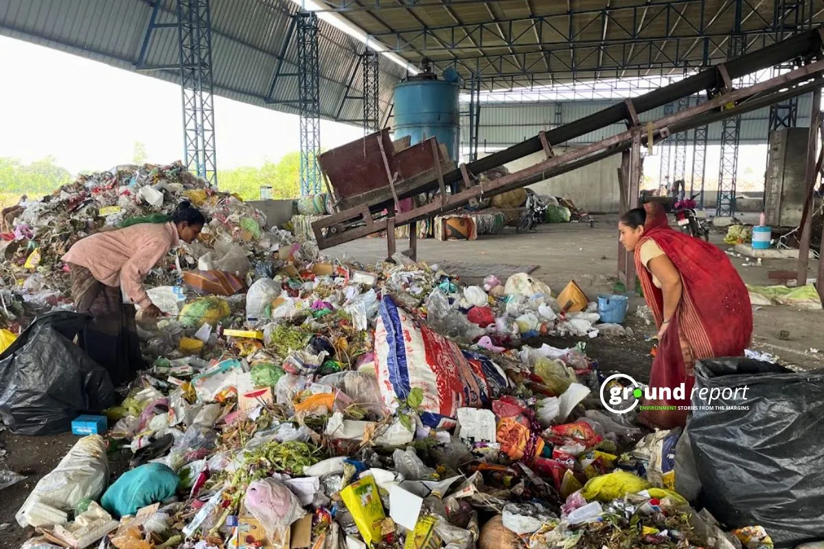 Workers separating mixed waste at Sehore landfill site