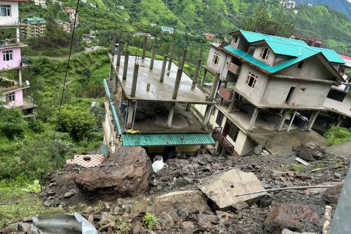 Severe damage in Shimla following a cloudburst, with landslides impacting buildings and infrastructure