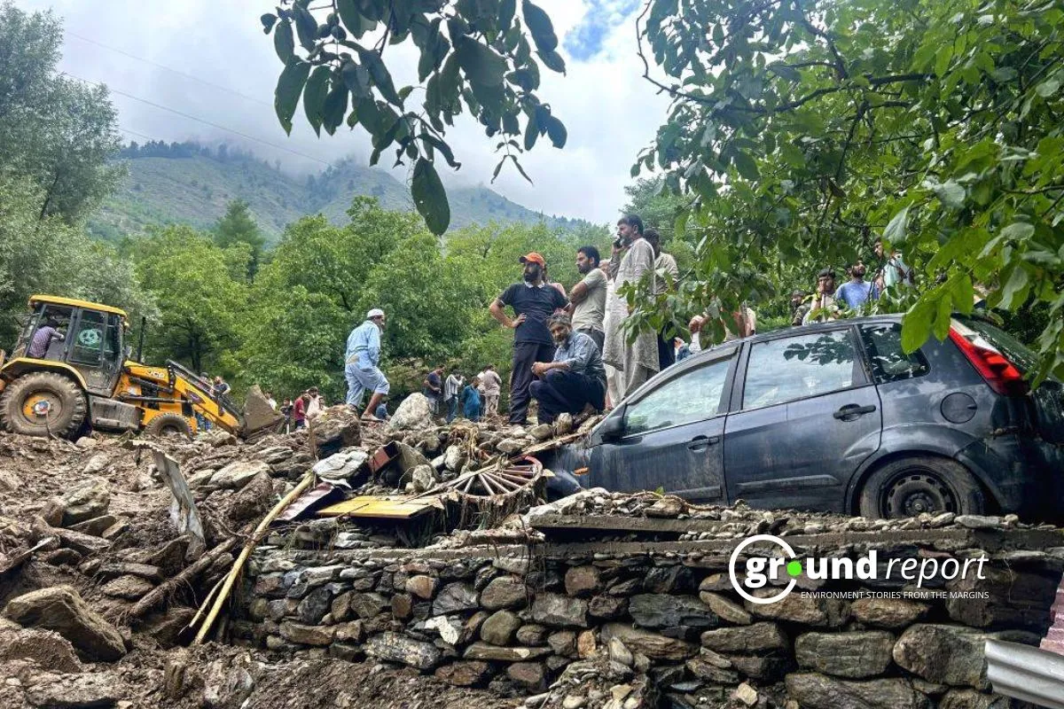 Residents of Padabal Village gather to assess the extensive damage caused by a recent landslide