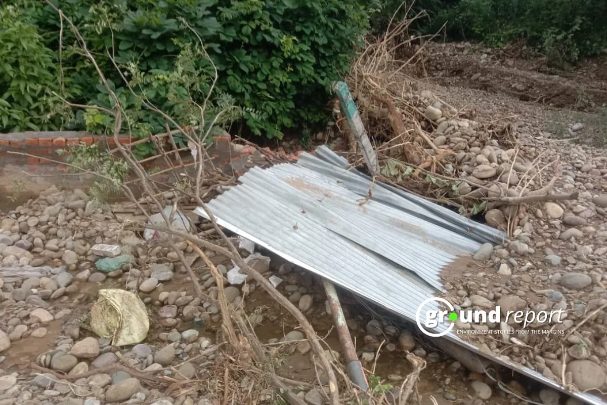 A sturdy shelter lies in ruins after the cloudburst in Doonga village, a reminder of the destructive power of natural disasters.