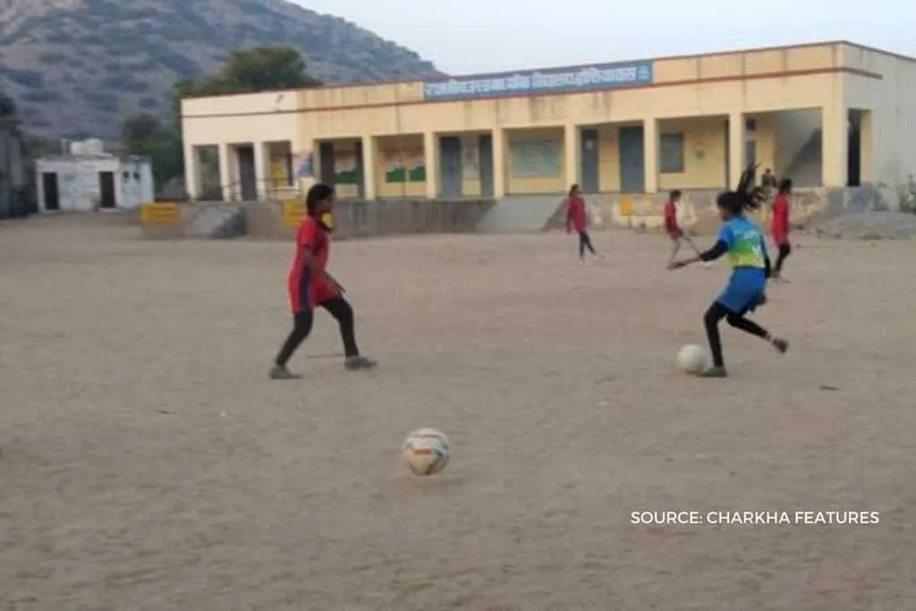 Girls learning soccer skills through smartphones 