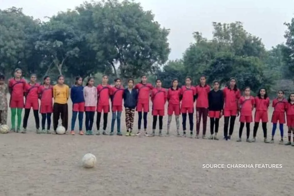 Girls learning soccer skills through smartphones 