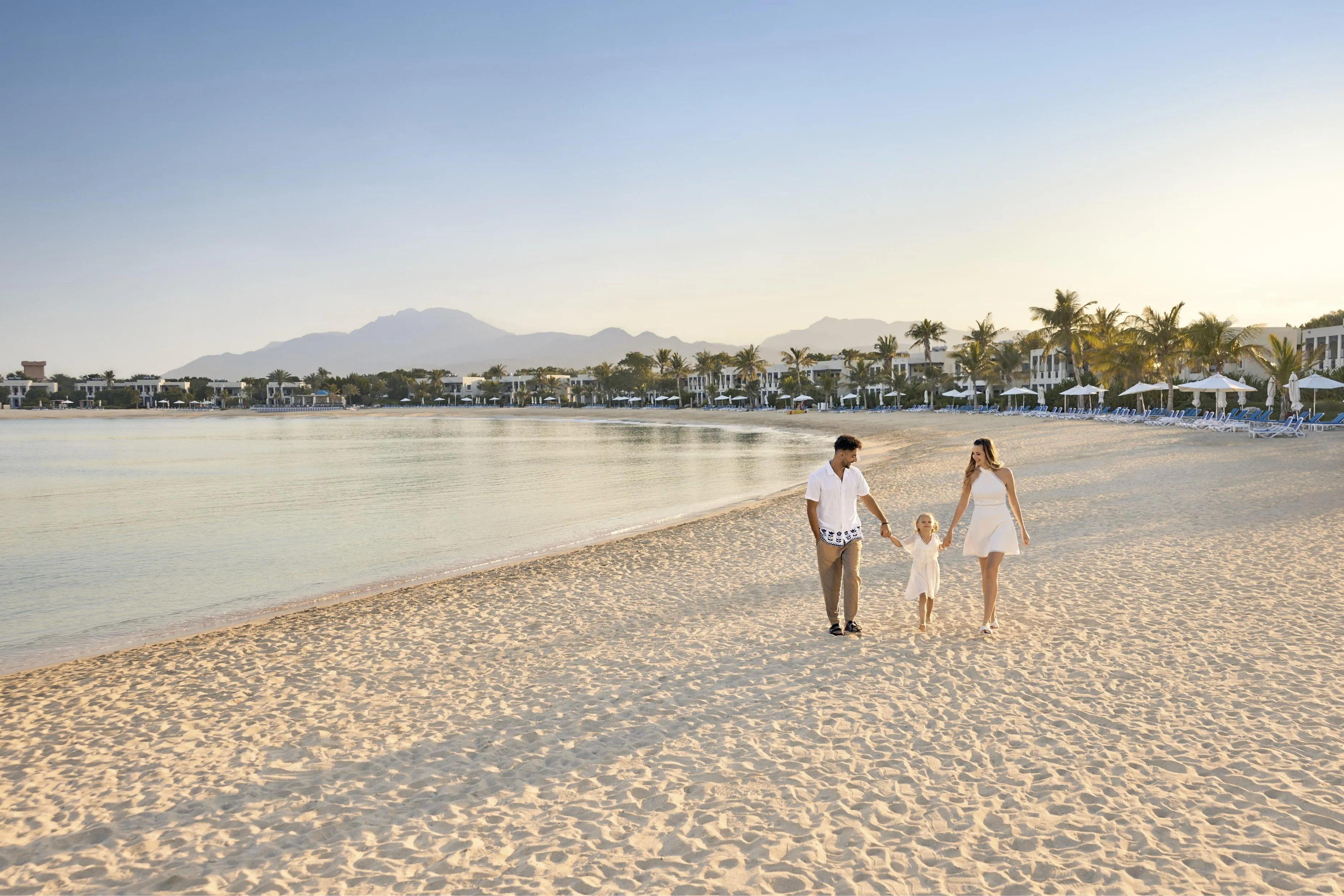 Family on a beach in RAK