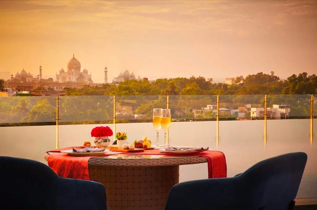 Immerse yourself in a luxurious Holi celebration inspired by the vibrant Phoolon Ki Holi of Braj.  Highlights:  - Thandai Ritual with handcrafted blends - Maharaja's Thandai Trolley - Floral rangolis and intricate decorations - Live Sufi-folk performances and exclusive Floral Attar Bar - Royal celebratory feast at Daawat-e-Nawab - Phoolon Ki Holi celebration with flower petals, dhol beats, and Radha-Krishna Leelas - Festive Holi brunch at Palato with live stations and fusion music  Experience the magic of Holi in Agra's royal style!