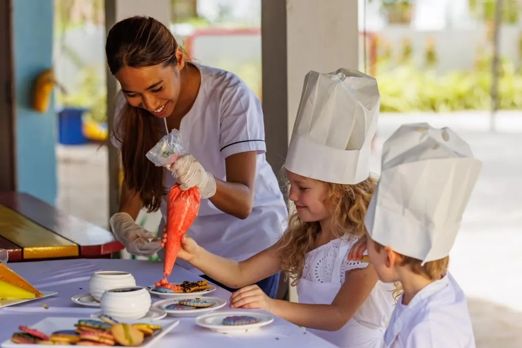 Where young explorers discover educational and playful lessons through curated activities while parents relish precious moments of tranquillity along our powder-soft shores