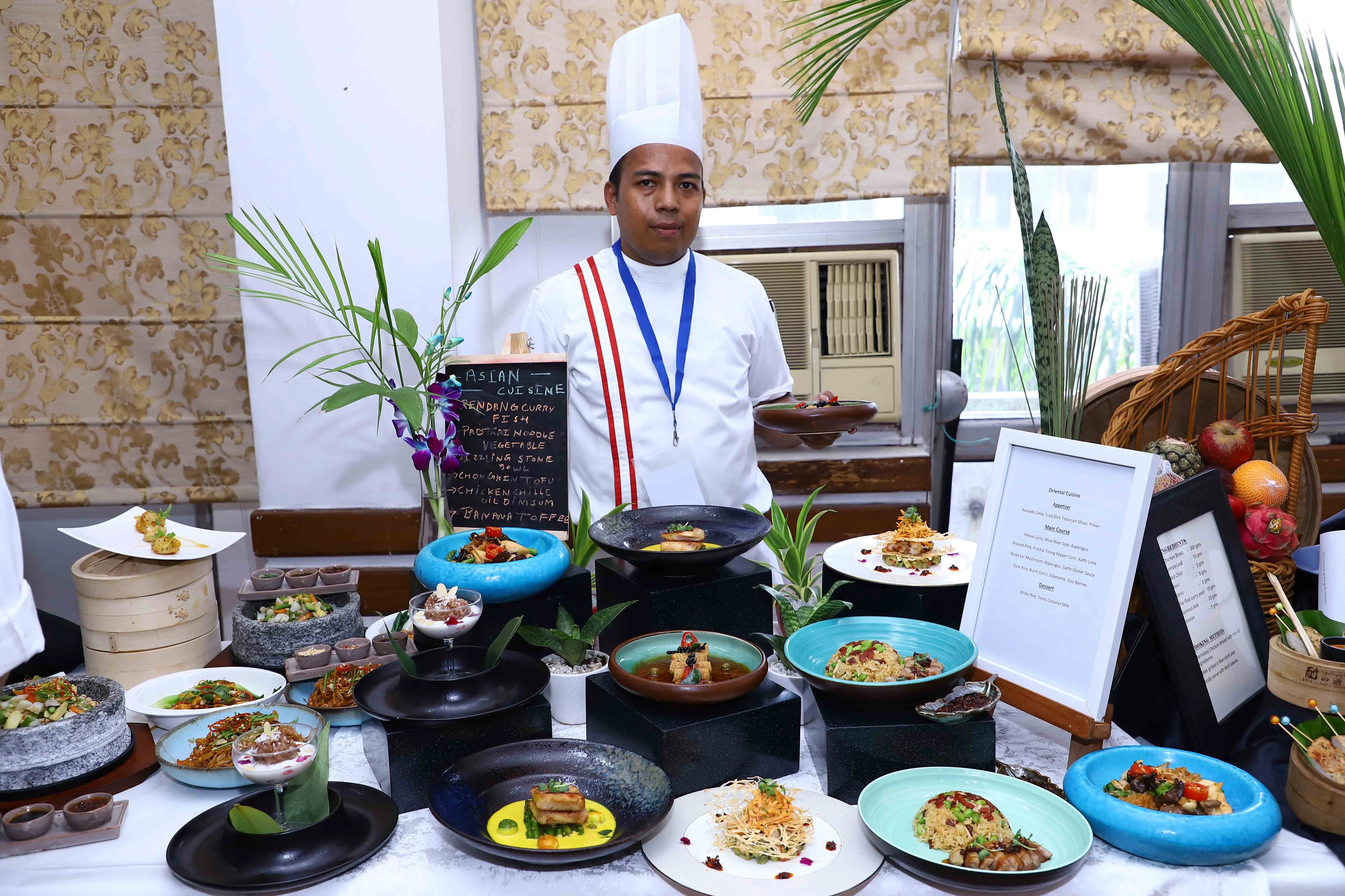 Chef showcasing a dish for the Master Chef Oriental Cuisine competition