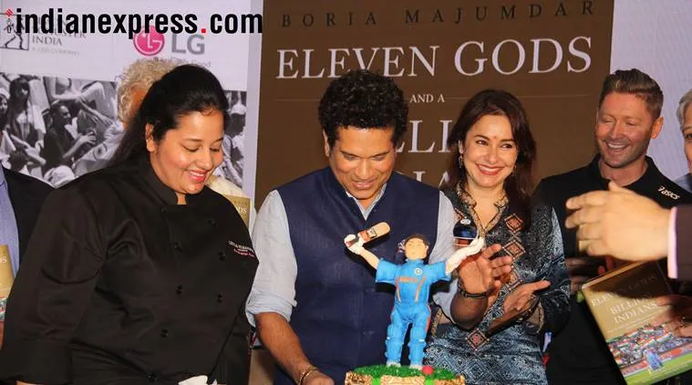 Sachin Tendulkar cuts a special cake made for his 45th birthday. (Photo by: Varinder Chawla)