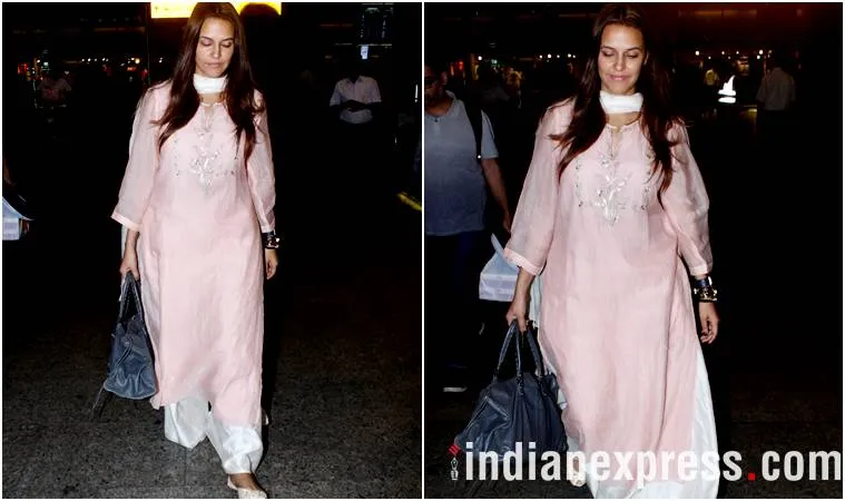 Neha Dhupia kept it traditional and comfortable in a pastel pink salwar suit. (Source: Express Photo by Varinder Chawla)