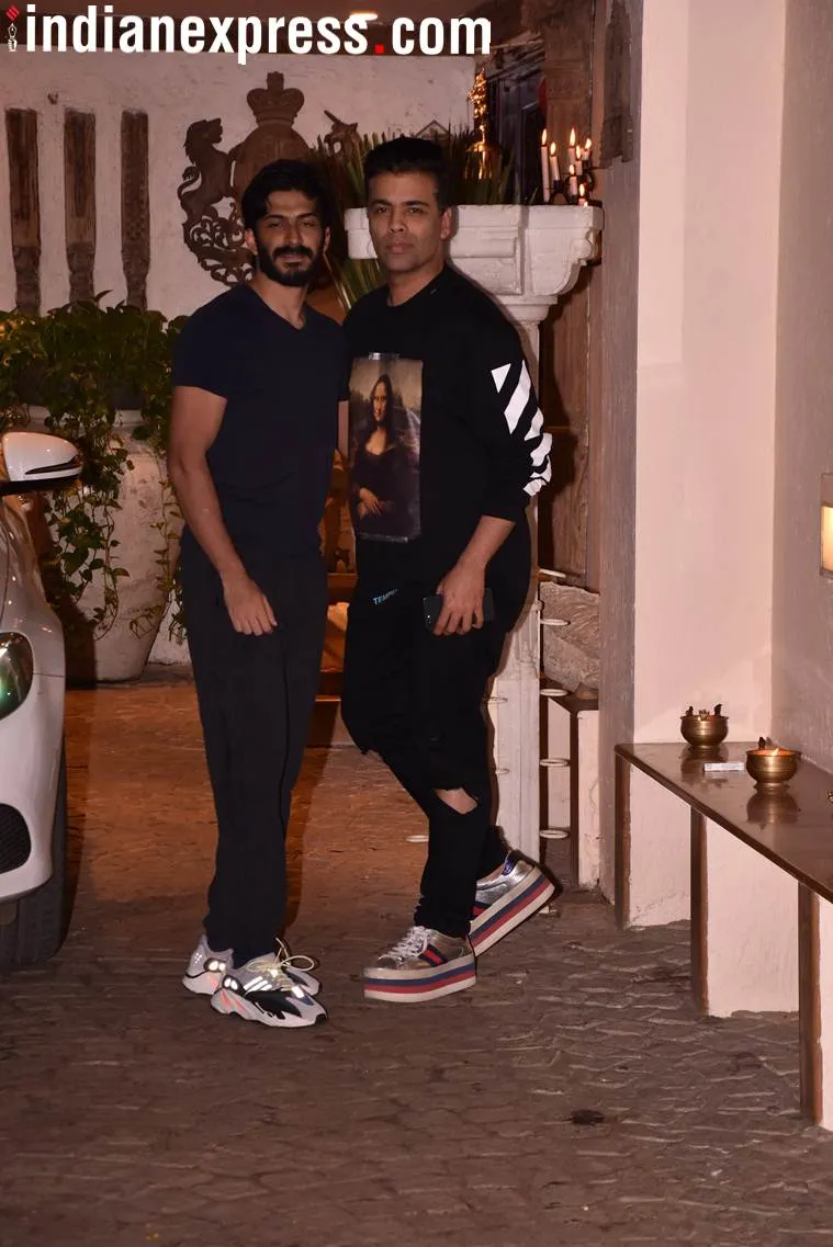 Hrashvardhan Kapoor and Karan Johar posed for the shutterbugs.