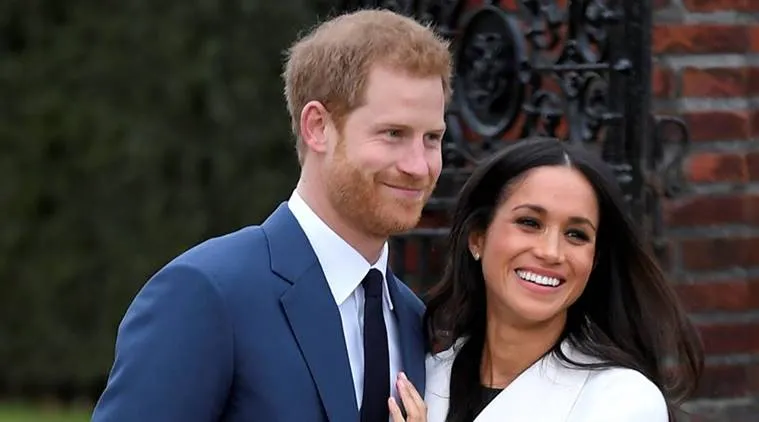 Britain's Prince Harry poses with Meghan Markle in the Sunken Garden of Kensington Palace, London