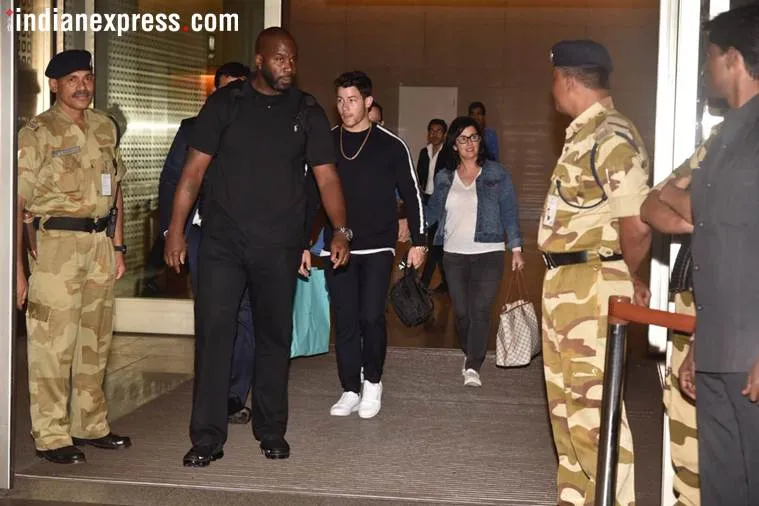 Nick Jonas and his mother walk out of Mumbai airport. (Photo: Varinder Chawla)