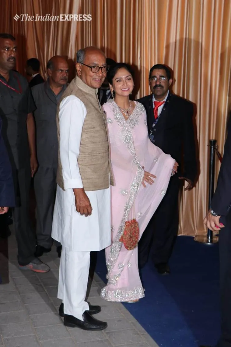 Digvijaya Singh and wife Amrita Rai are all smiles as they arrive for Isha Ambani and Anand Piramal's wedding reception. (Photo by Varinder Chawla)