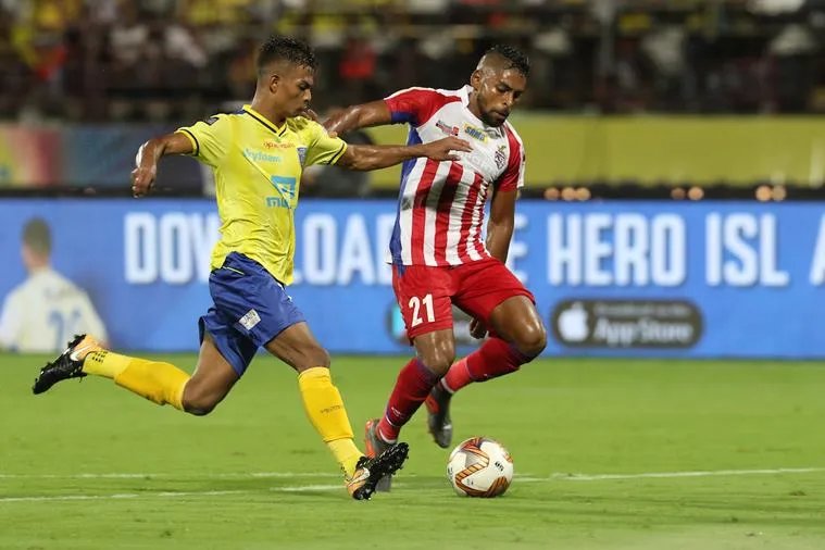 Roy Krishna of ATK and Thounaojam Jeakson Singh of Kerala Blasters FC in action during the opening ceremony and first match of the Indian Super League ( ISL ) between the Kerala Blasters FC and ATK held at the Jawaharlal Nehru Stadium, Kochi, India on the 20th October 2019