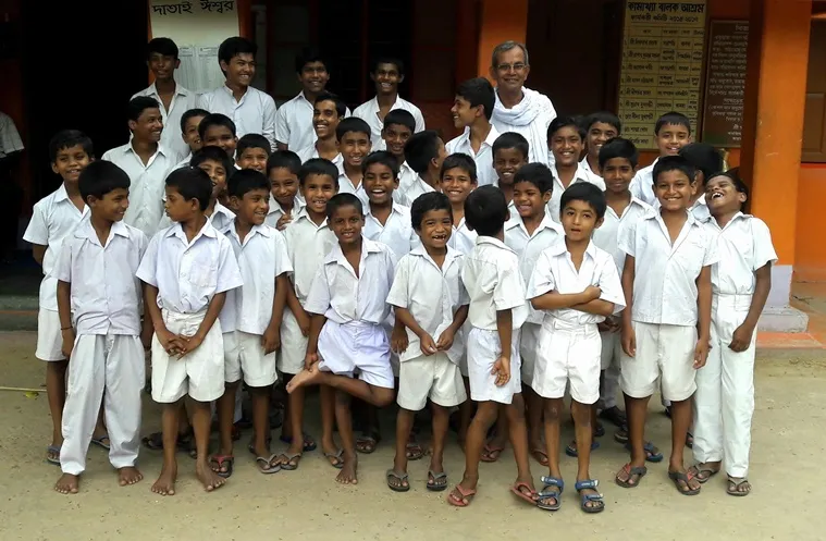 Founder Madhab Bhattacharya with the students of his orphanage