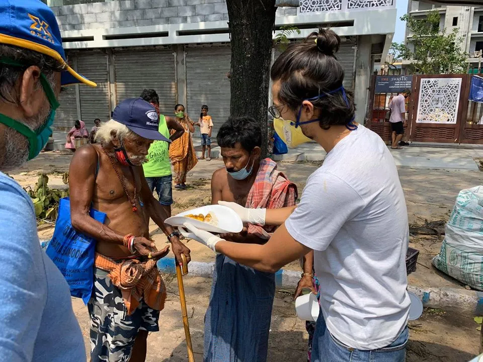 Actress Chaiti Ghoshal and son Amartya feeding homeless Amphan Affected people in Kolkata