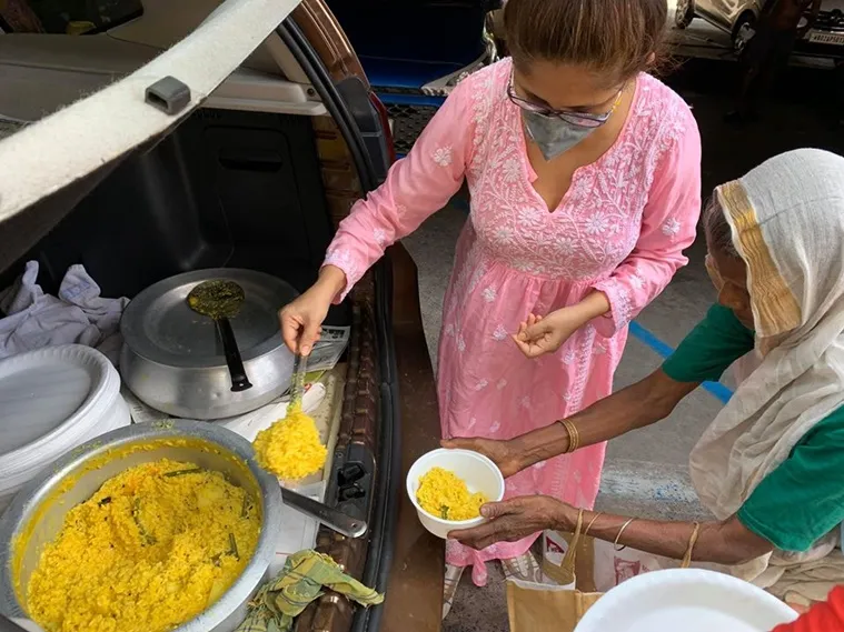 Actress Chaiti Ghoshal and son Amartya feeding homeless Amphan Affected people in Kolkata
